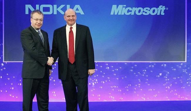 File photo of Nokia chief executive Stephen Elop welcoming Microsoft chief executive Steve Ballmer with a handshake at a Nokia event in London